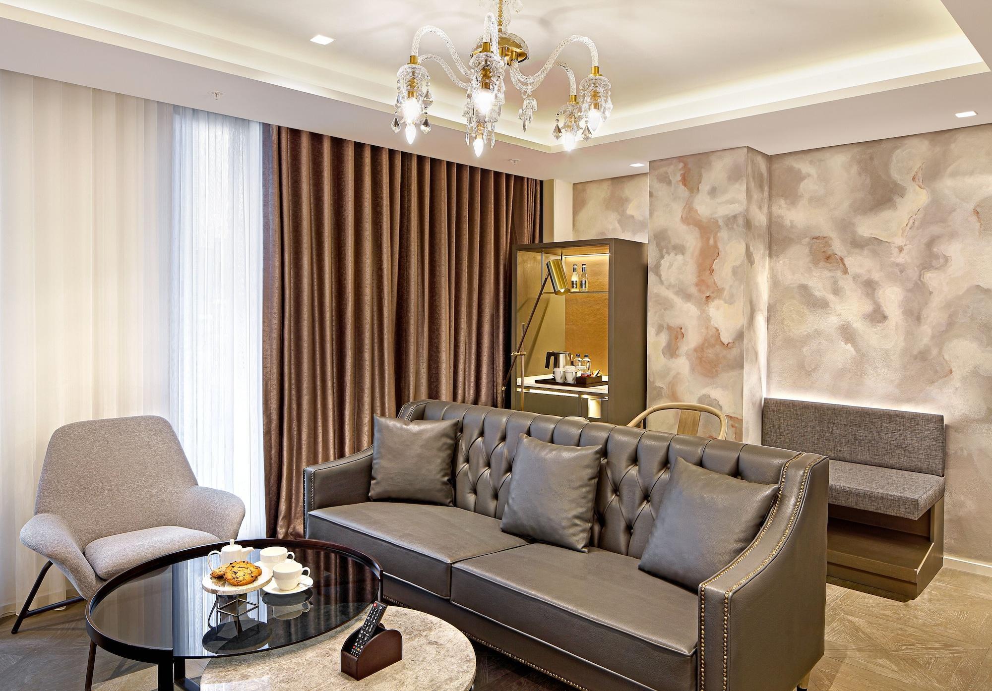 Wanda Vista Istanbul Istambul Exterior foto A living room in a suite at the hotel